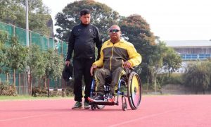 Vinod being assisted by one of his trainers