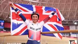 Storey proudly poses with her country's flag after winning