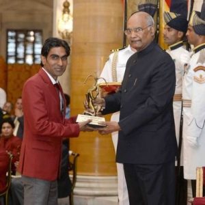 Pramod Bhagat receiving an award from President Ram Nath Kovind