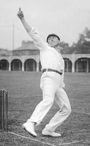 Wilfred Rhodes of England in action.