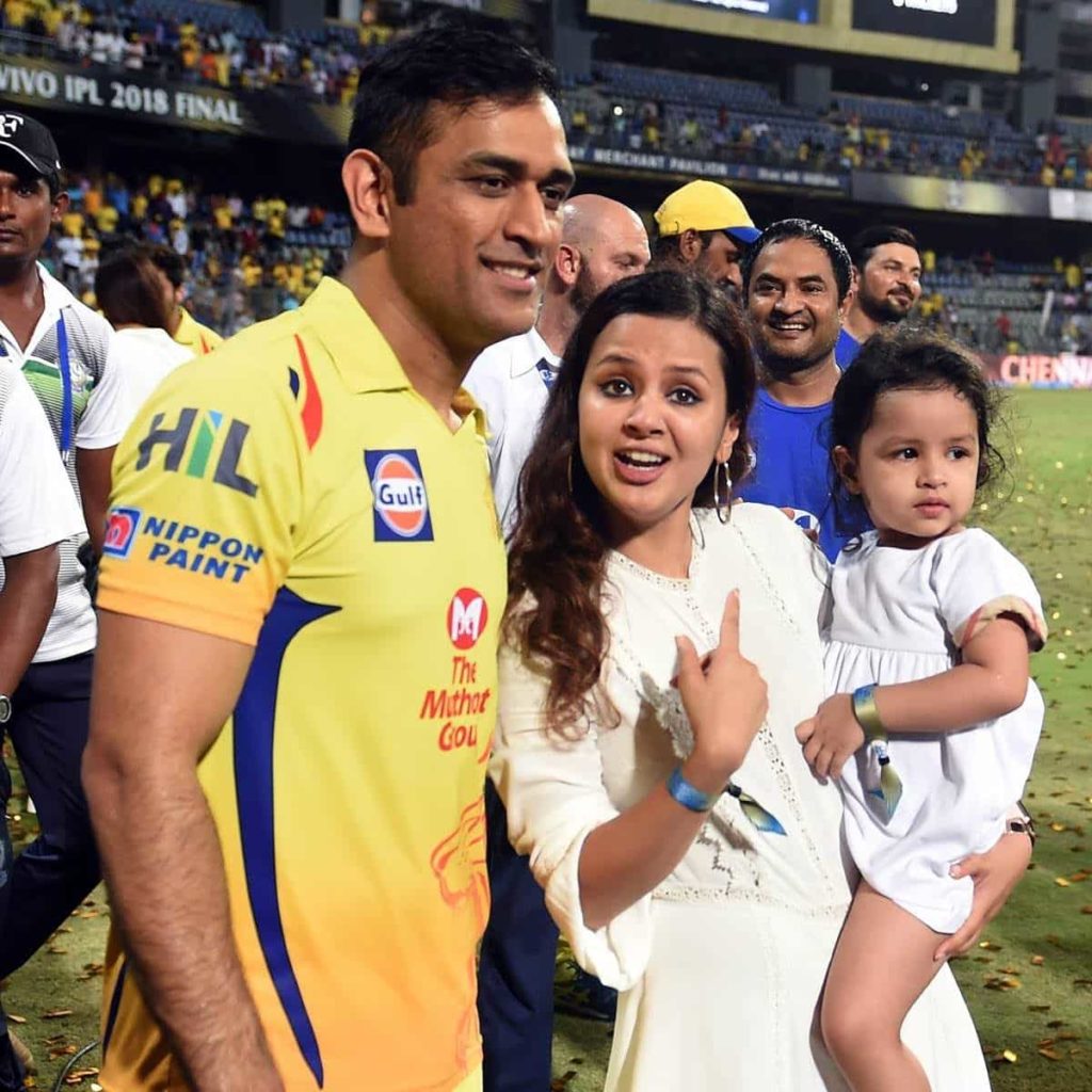 Dhoni with his wife and daughter
