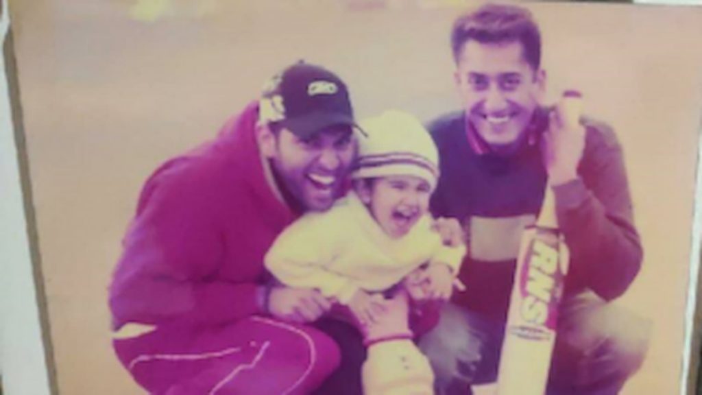 Yuvraj Singh with the young cricketer and his father.