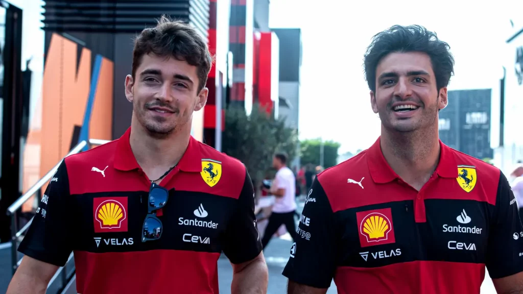 Charles Leclerc with Carlos Sainz after the latter helped him to become Ferrari's third highest pole-sitter