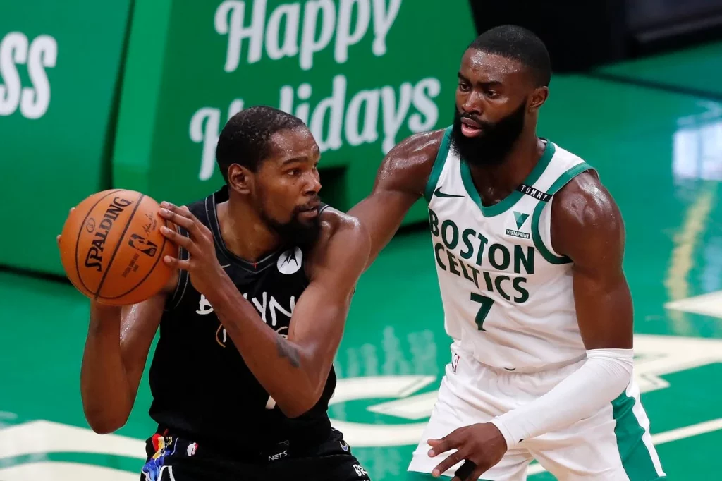 Kevin Durant and Jaylen Brown during a game.
