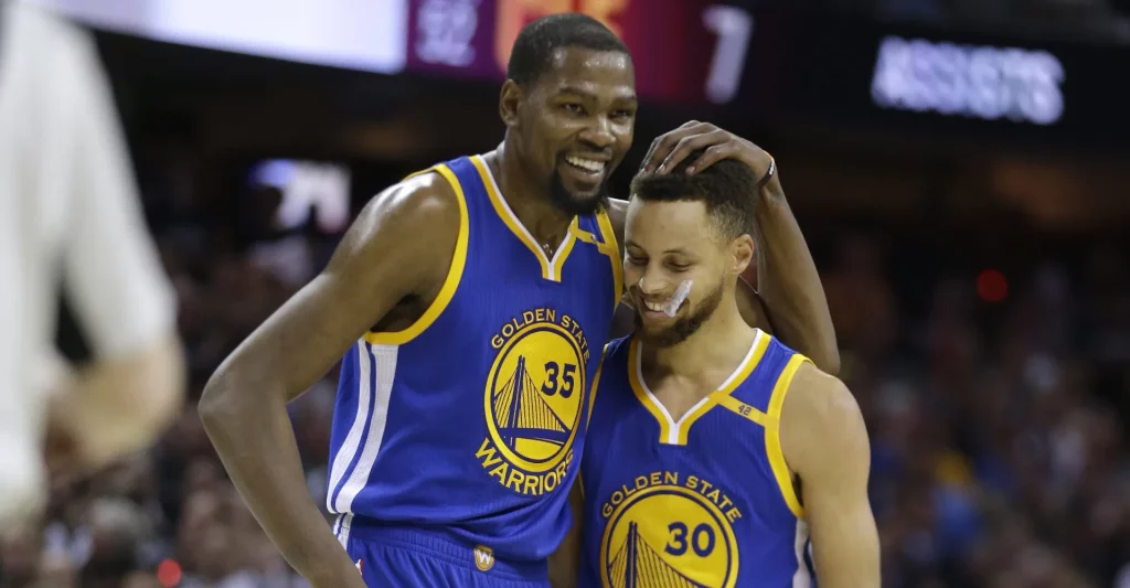 Kevin Durant and Stephen Curry during a game for the Warriors.