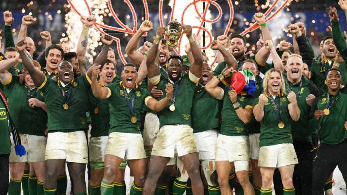 Siya Kolisi, representing South Africa, proudly raises The Webb Ellis Cup in a memorable moment after the Rugby World Cup Final contest against New Zealand at Stade de France on October 28, 2024, in Paris, France. (Photo credit: David Ramos - World Rugby/World Rugby via Getty Images)