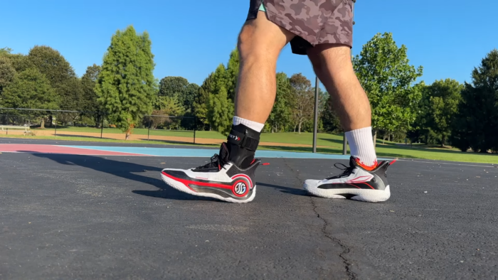 Man Wearing an Ankle Brace While Playing Basketball on The Court