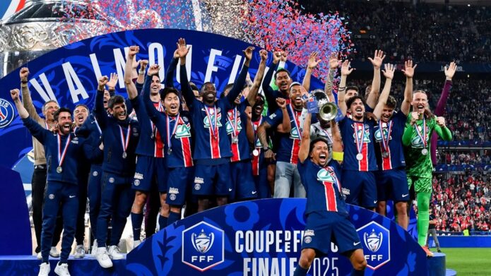 PSG players lift a trophy in celebration after winning the UEFA Champions League 2025
