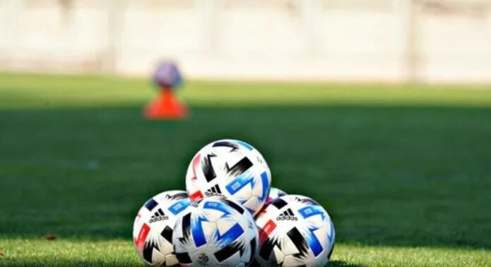 Practice balls on a grass pitch